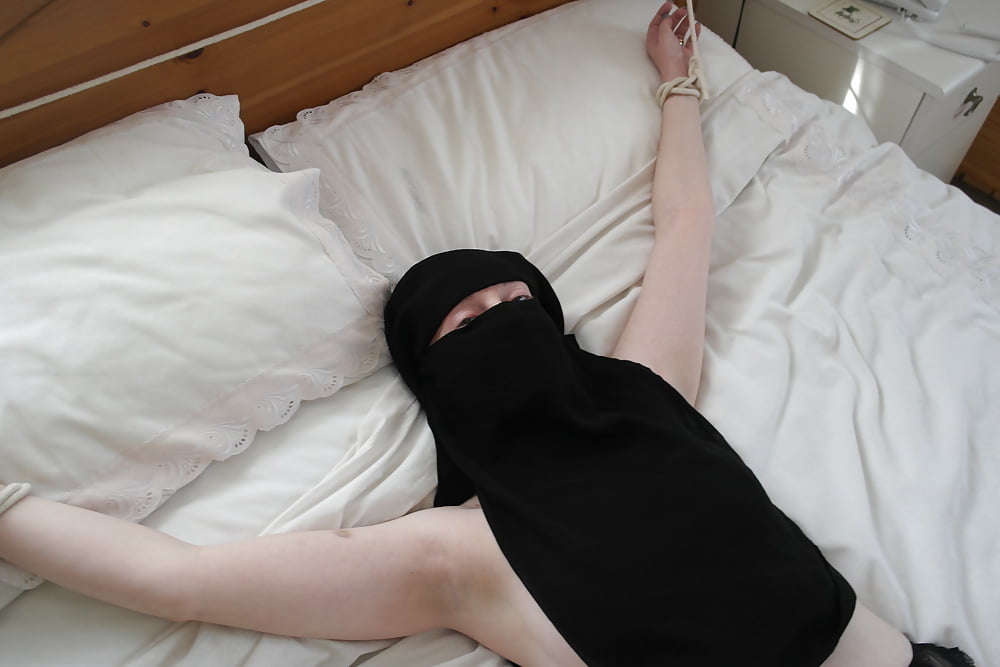 Niqab girl in Stockings Tied spread Eagle