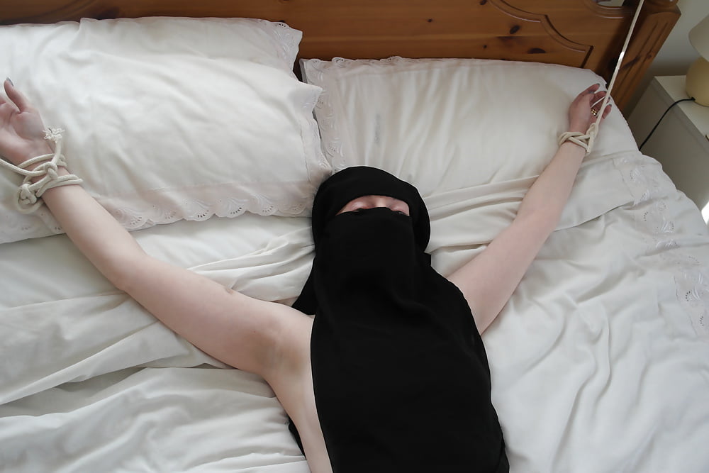 Niqab girl in Stockings Tied spread Eagle