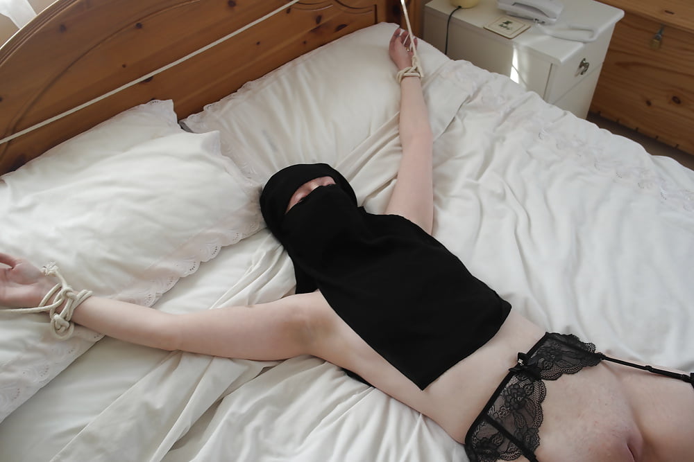 Niqab girl in Stockings Tied spread Eagle